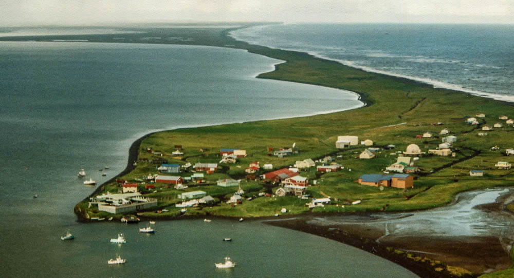 The Aleut village of Nelson Lagoon from the air showing the lagoon and the Bering Sea.