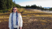 Melissa Cook at the former Thorne Bay, Alaska Dump with fog coming off the chip covered ground