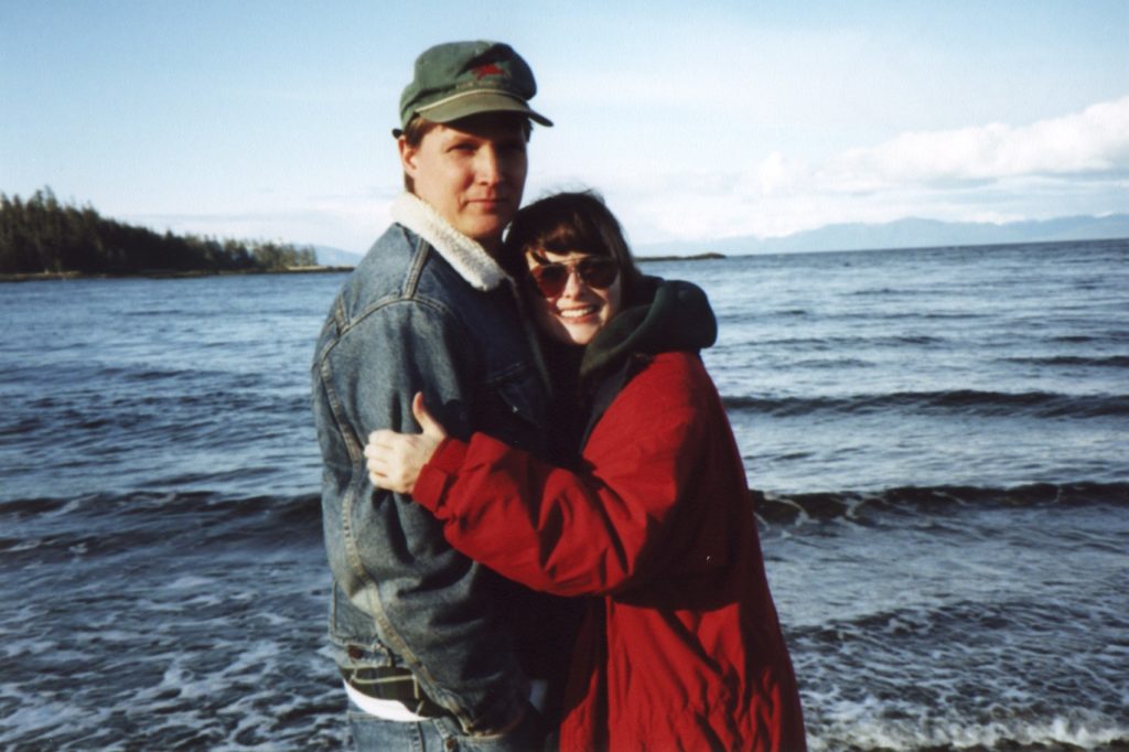 Elgin and Melissa Cook hug on Sandy Beach on Prince of Wales Island in 1997