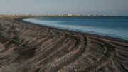 Nelson Lagoon in the distance with the lagoon and beach in the foreground