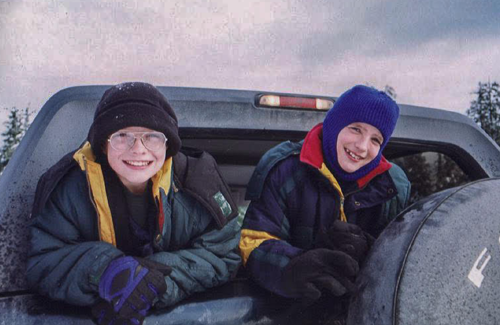 Everett & Sutton Cook looking out the back of the Bronco window in Alaska