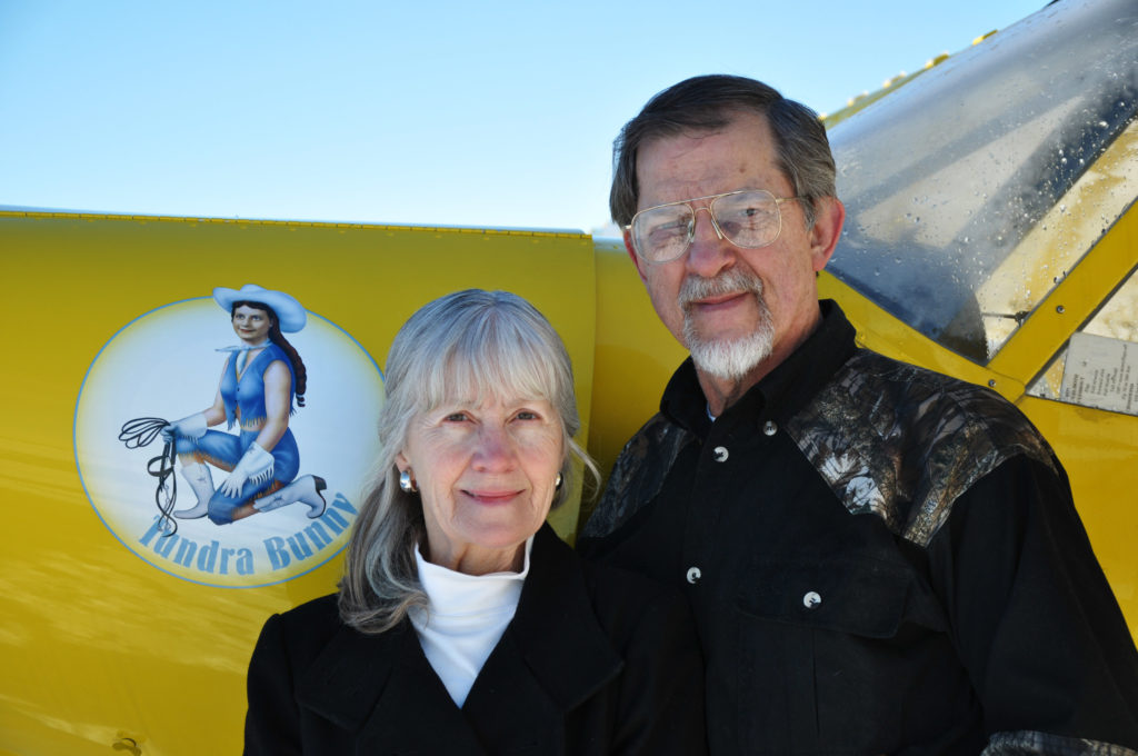 Larry and Pam Kaniut Stand by their yellow plane
